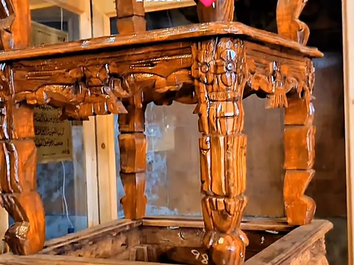 Carved console with glass